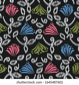 Seamless abstract ikat pattern with the image of floral ornament.
