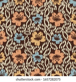 Seamless abstract ikat pattern with the image of floral ornament.
