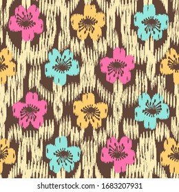 Seamless abstract ikat pattern with the image of floral ornament.
