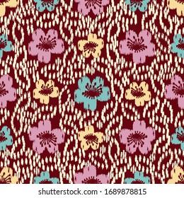 Seamless abstract ikat pattern with the image of floral ornament.
