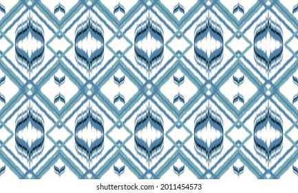 Seamless abstract ikat pattern.background ,carpet,wallpaper,clothing,wrapping,Batik,fabric,Vector illustration.embroidery style.
