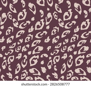 Seamless abstract leopard print pattern. Modern chunky animal spots in cream beige on a dark burgundy maroon background. Bold graphic vector illustration for apparel, textile, and wallpaper.