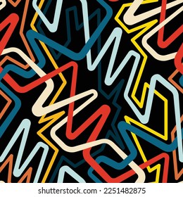 Seamless abstract multicolored pattern. Tangled lines in a modern graffiti style. Interlaced yellow, blue, red, and white lines on a black background. Graphic textile texture. Vector image.