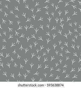 Seamless abstract pattern with bird trail. Vector illustration. Light Bird footprints track on grey background.