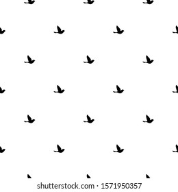 Seamless abstract pattern with black flying  birds on white background. Decorative wallpaper, good for printing and fabric. Vector illustration.  Black and white.