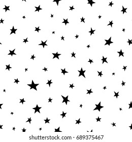 Seamless abstract pattern with black hand drawn shabby stars of different size on white background. Vector illustration black and white.