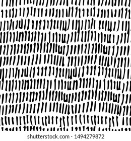 Seamless abstract pattern with black vertical strokes and lines on white background. Hand-drawn scribbles. Vector background. Brush stroke.