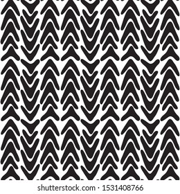 Seamless abstract pattern with black vertical strokes and lines on white background. Modern graphics. Brush stroke. Ethnic stylized background in vector.