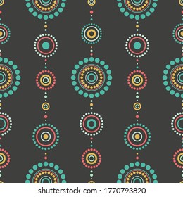 Nahtlose abstrakte Muster von blauen, orangefarbenen und grünen Kreisen und Punkten auf schwarzem Hintergrund. Kaleidoskop-Ornament. Mandala Tapete, gut zum Drucken. Vektorgrafik. Ethnischer Stil