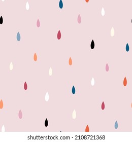 Seamless abstract pattern with bright multi-colored drops on a pink background