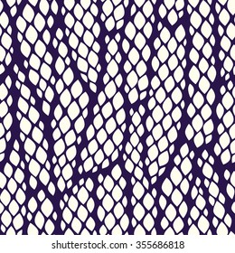 Seamless abstract pattern with colorful rhombuses. Vector illustration with leaves. Snake skin texture.