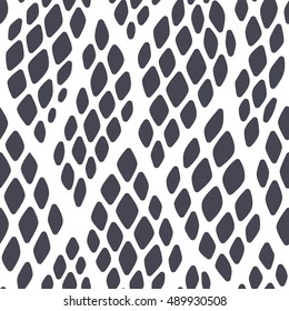 Seamless abstract pattern with colorful rhombuses. Vector illustration with leaves. Reptiles skin texture.