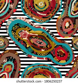 Seamless abstract pattern of elongated circles with different textures with tribal elements.