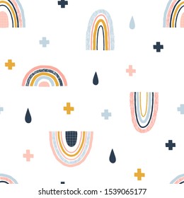 Seamless abstract pattern with hand drawn rainbows rain drops and crosses. Creative scandinavian childish background for fabric, wrapping, textile, wallpaper, apparel. Vector illustration