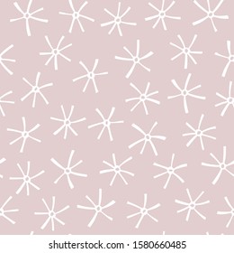Seamless abstract pattern with hand drawn snowflakes on a dusty pink background. Vector illustration.
