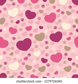 Seamless abstract pattern of hearts and circles.
