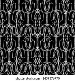 Seamless abstract pattern. Imitation lace. White lace on black background. Black and white graphics. For design and decoration of fabric, paper, Wallpaper and packaging.Mesh pattern.