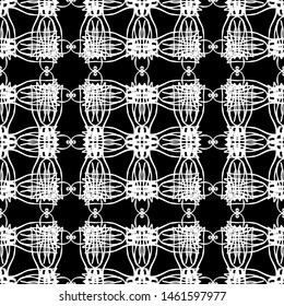 Seamless abstract pattern. Imitation lace. White lace on black background. Black and white graphics. For design and decoration of fabric, paper, Wallpaper and packaging.Mesh pattern.