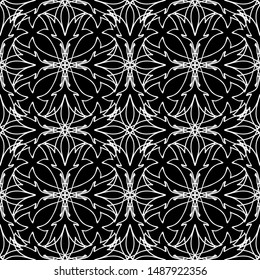 Seamless abstract pattern. Imitation lace. White lace on black background. Black and white graphics. For design and decoration of fabric, paper, Wallpaper and packaging.Mesh pattern.