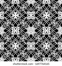 Seamless abstract pattern. Imitation lace. White lace on black background. Black and white graphics. For design and decoration of fabric, paper, Wallpaper and packaging.Mesh pattern. 