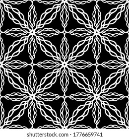 Patrón abstracto sin inconvenientes. Imitación de encaje. Lazo blanco sobre fondo negro. Gráficos en blanco y negro. Para el diseño y la decoración de tela, papel, papel pintado y embalaje.Patrón de malla. 