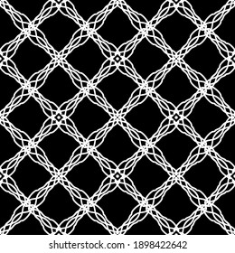 Seamless abstract pattern. Imitation lace. White lace on black background. Black and white graphics. For design and decoration of fabric, paper, Wallpaper and packaging.Mesh pattern.