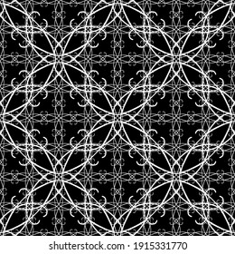 Seamless abstract pattern. Imitation lace. White lace on black background. Black and white graphics. For design and decoration of fabric, paper, Wallpaper and packaging.Mesh pattern.
