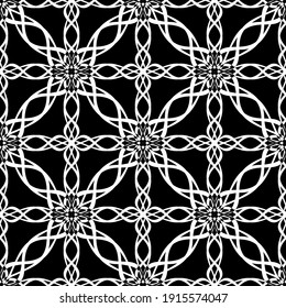 Seamless abstract pattern. Imitation lace. White lace on black background. Black and white graphics. For design and decoration of fabric, paper, Wallpaper and packaging.Mesh pattern.