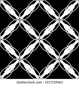 Patrón abstracto sin inconvenientes. Imitación de encaje. Lazo blanco sobre fondo negro. Gráficos en blanco y negro. Para el diseño y la decoración de tela, papel, papel pintado y embalaje.Patrón de malla.