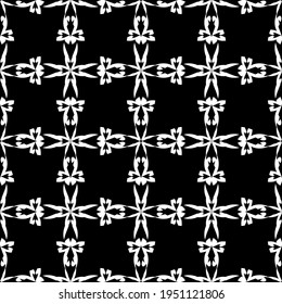 Seamless abstract pattern. Imitation lace. White lace on black background. Black and white graphics. For design and decoration of fabric, paper, Wallpaper and packaging.Mesh pattern.