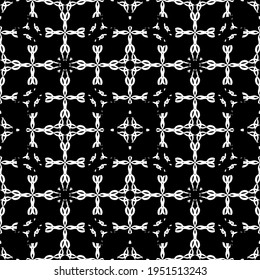 Seamless abstract pattern. Imitation lace. White lace on black backround. Black and white graphics. For design and decoratiogn of fabric, paper, Wallpaper and packaging.Mesh pattern.