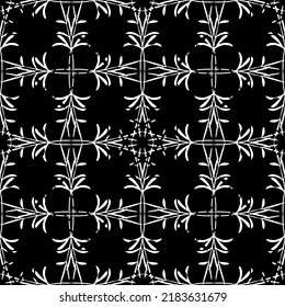 Seamless abstract pattern. Imitation lace. White lace on black background. Black and white graphics. For design and decoration of fabric, paper, Wallpaper and packaging.Mesh pattern.