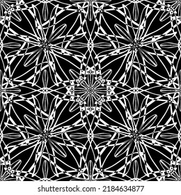 Seamless abstract pattern. Imitation lace. White lace on black background. Black and white graphics. For design and decoration of fabric, paper, Wallpaper and packaging.Mesh pattern.