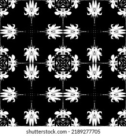 Seamless abstract pattern. Imitation lace. White lace on black background. Black and white graphics. For design and decoration of fabric, paper, Wallpaper and packaging.Mesh pattern.