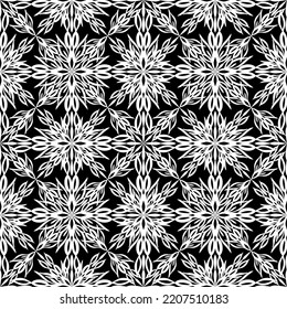 Seamless abstract pattern. Imitation lace. White lace on black background. Black and white graphics. For design and decoration of fabric, paper, Wallpaper and packaging.Mesh pattern.