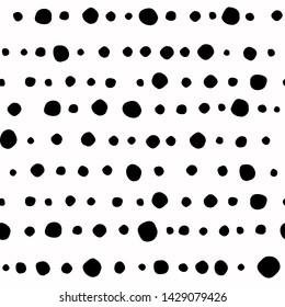 Seamless abstract pattern of little black shabby dots or spots on white. Hand drawn, offhand style. Decorative wallpaper, good for printing. Vector illustration. Black and white.