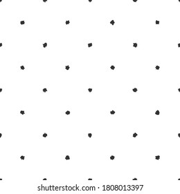 Seamless abstract pattern of little black shabby dots or spots on white. Hand drawn, offhand style. Decorative wallpaper, good for printing. Vector illustration. Black and white.