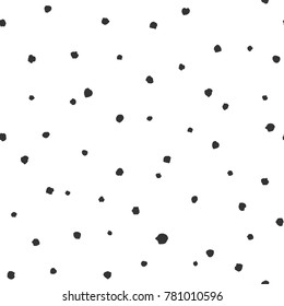 Seamless abstract pattern of little black shabby dots or spots on white. Hand drawn, offhand style. Decorative wallpaper, good for printing. Vector illustration. Black and white.