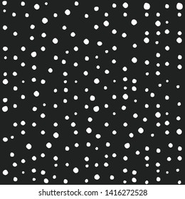 Seamless abstract pattern of little white shabby dots or spots on black background. Hand drawn, offhand style. Decorative wallpaper, good for printing. Vector illustration. Black and white.