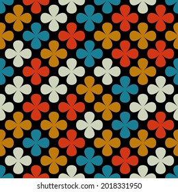 seamless abstract pattern of multicolored flowers on a dark background for prints on fabrics, clothing, packaging, ceramics, covers, as well as for interior design