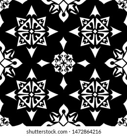 Seamless abstract pattern. On a black background an ornament from white geometrical figures. Vector illustration.