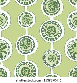 Seamless abstract pattern. On a green background, circles painted in ethnic style. Print for paper and textiles. Vector illustration.