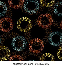 Seamless abstract pattern in polka dot style.  Black background. Seamless vector illustration with pink and purple geometric shapes.