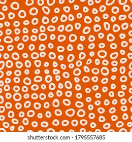 Seamless abstract pattern with rings on orange background. Simple vector illustration for wallpaper; wrapping; surface design