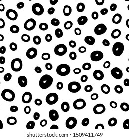 Seamless abstract pattern with round shape in black. Hand drawn circle objects in chaotic composition. Vector illustration for textile print, fabric, wrapping paper. White neutral background.