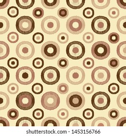 Seamless abstract pattern in scribble style with the image of rings and circles.
