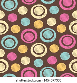 Seamless abstract pattern in scribble style with the image of rings and circles.
