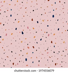 seamless abstract pattern of small angular motley shapes on a pink background for prints on fabrics for bed linen and light clothes, as well as for decoration of premises in a festive style