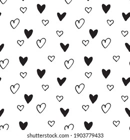 Seamless abstract pattern of small black hearts. Hand drawn doodle background, texture for textile, wrapping paper, Valentines day