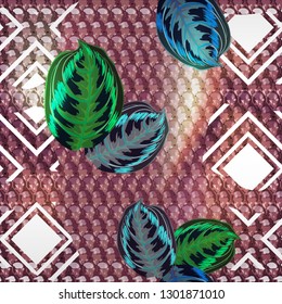Seamless abstract pattern - snake skin tropical leaves.